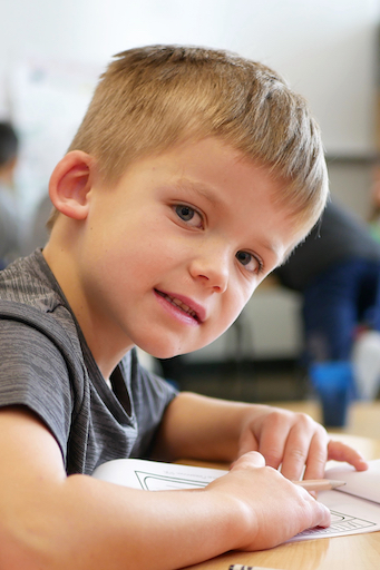 Student posing in class