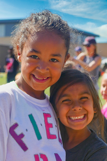 Two students posing outside